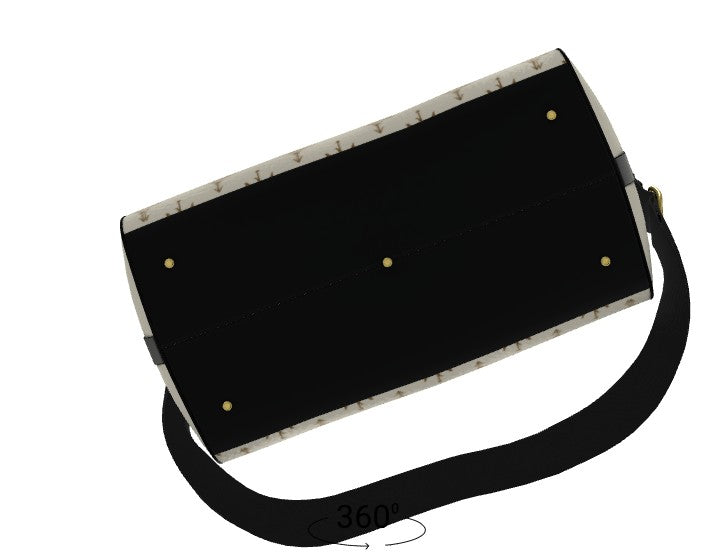 A black shoulder bag with a cream and black patterned strap, gold-tone studs, and a black adjustable strap, shown on a plain white background.